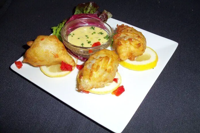 Artichoke fritters stuffed with Blue crab, served with a Béarnaise sauce