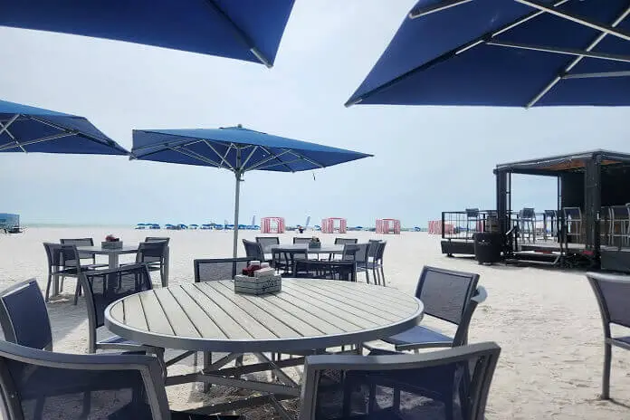 Outdoor dining with waterfront view at Quinn's on the Beach